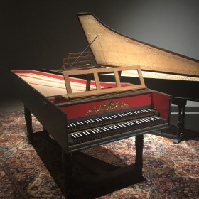 image of two harpsichord instruments on a persian carpet