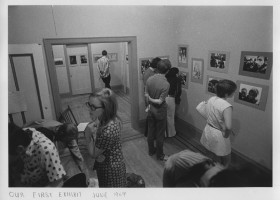 black and white image of people in an exhibition of photographs at Balwin St. Gallery in 1969