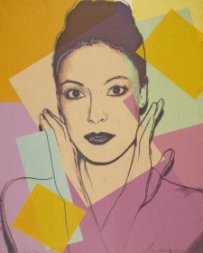 An Andy Warhol screenprint of Karen Kain in shades of ochre, mauve, mint green and dusty pink. Kain's hair is pulled up and her hands frame her face, wrists crossed at her chest. 