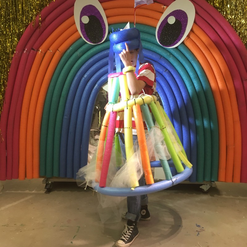 person dressed in costume made of colourful foam tubes and tulle
