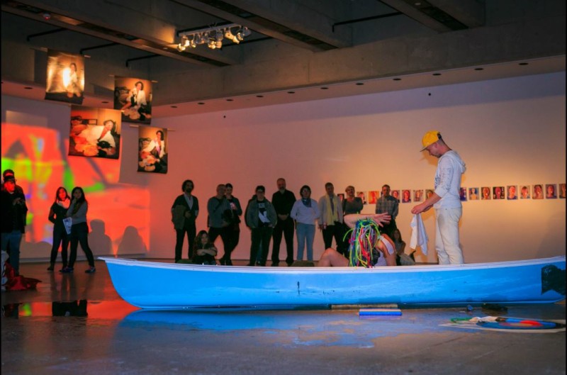 image of a performance art piece that features a blue canoe