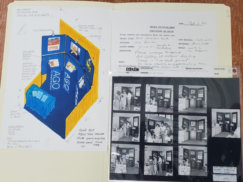 page from a notebooks with an drawing of a mock up for a trade fair booth. also pictures a contact sheet of black and white photos of the real life booth