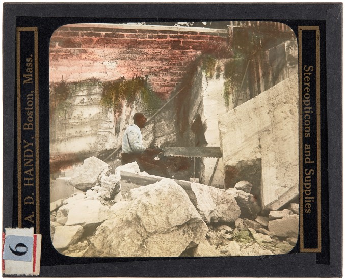 Sawing Out Blocks of Coral Rock, Bermuda, around 1910. Lantern slide: hand-painted gelatin silver on glass.