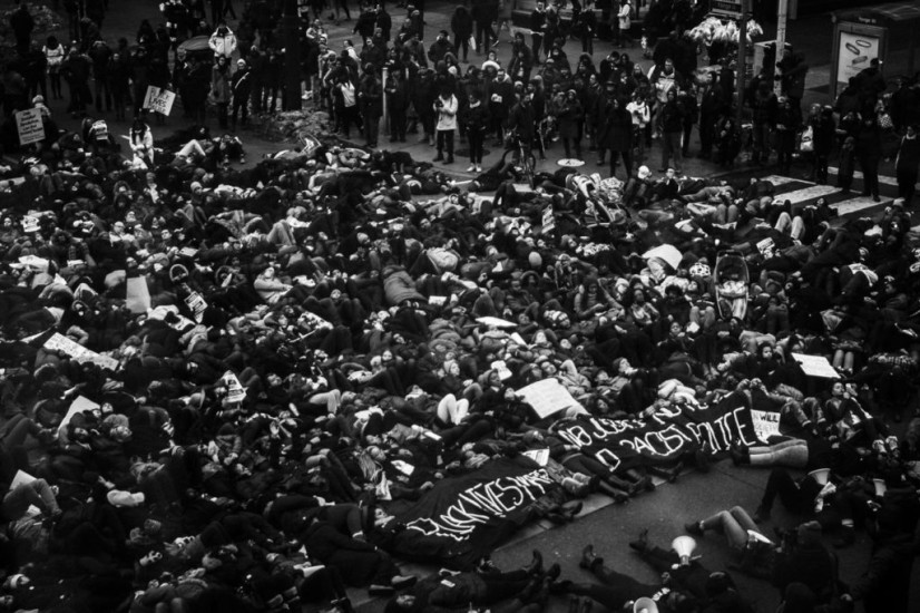 Jalani Morgan, Protesters perform a ‘die-in’ by laying on the ground at Yonge and Dundas Square in Toronto