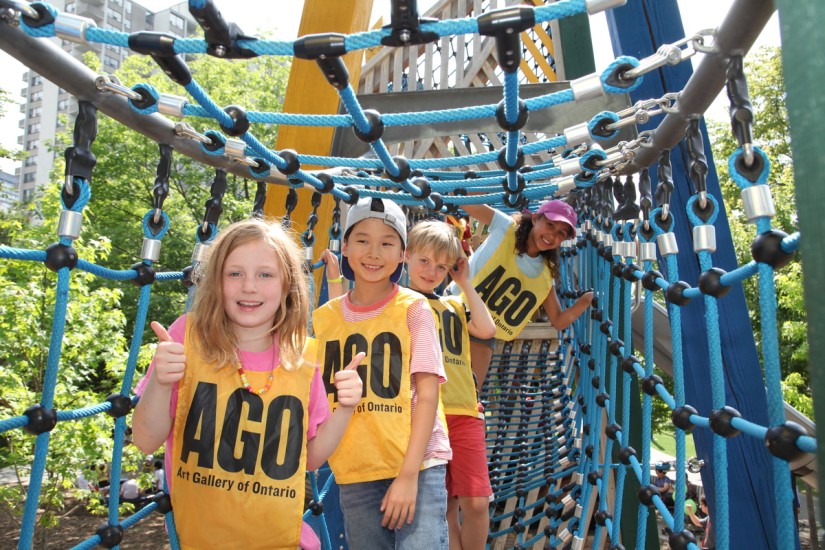 children on rope bridge play structure in Grange Park during AGO camp