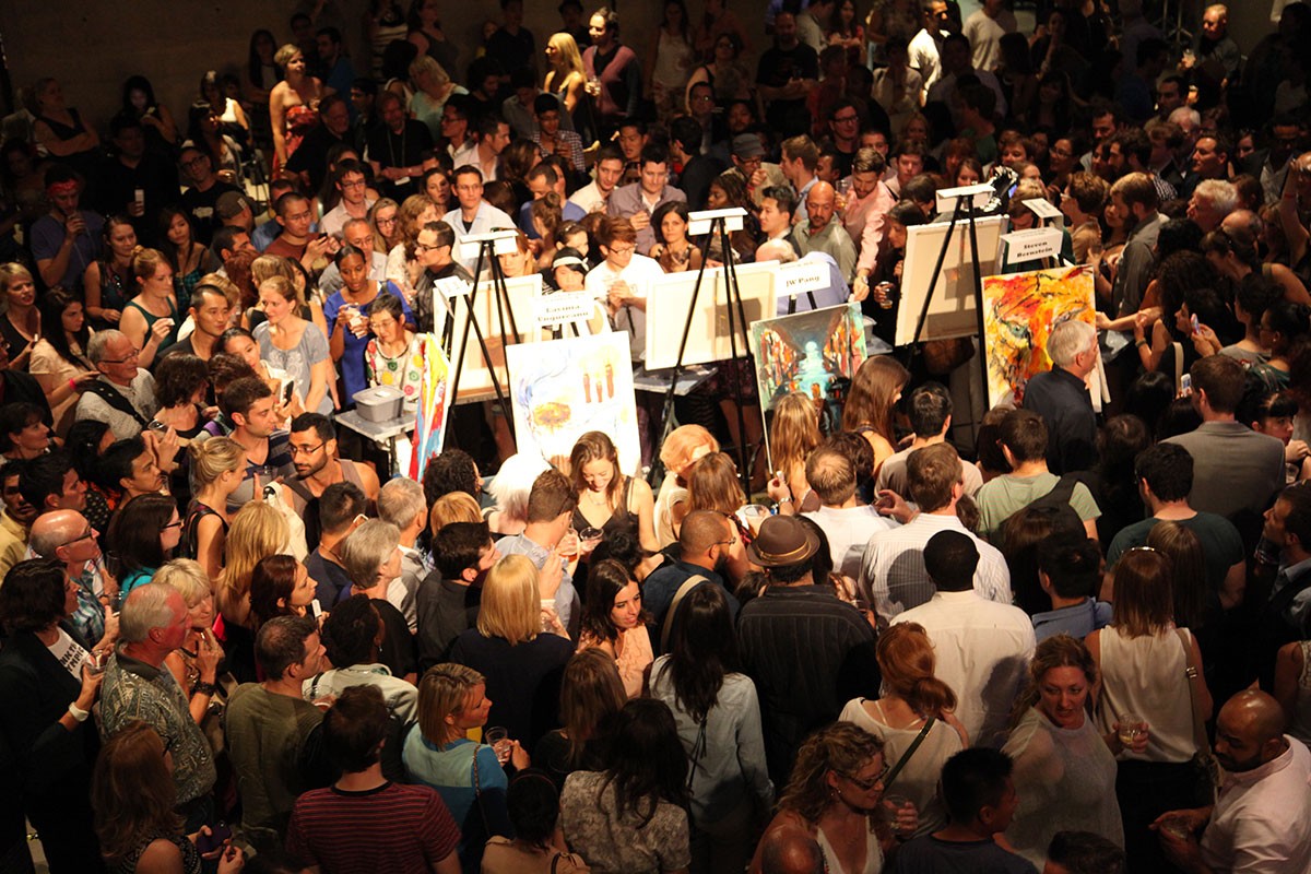 easels set up in a crowd of people