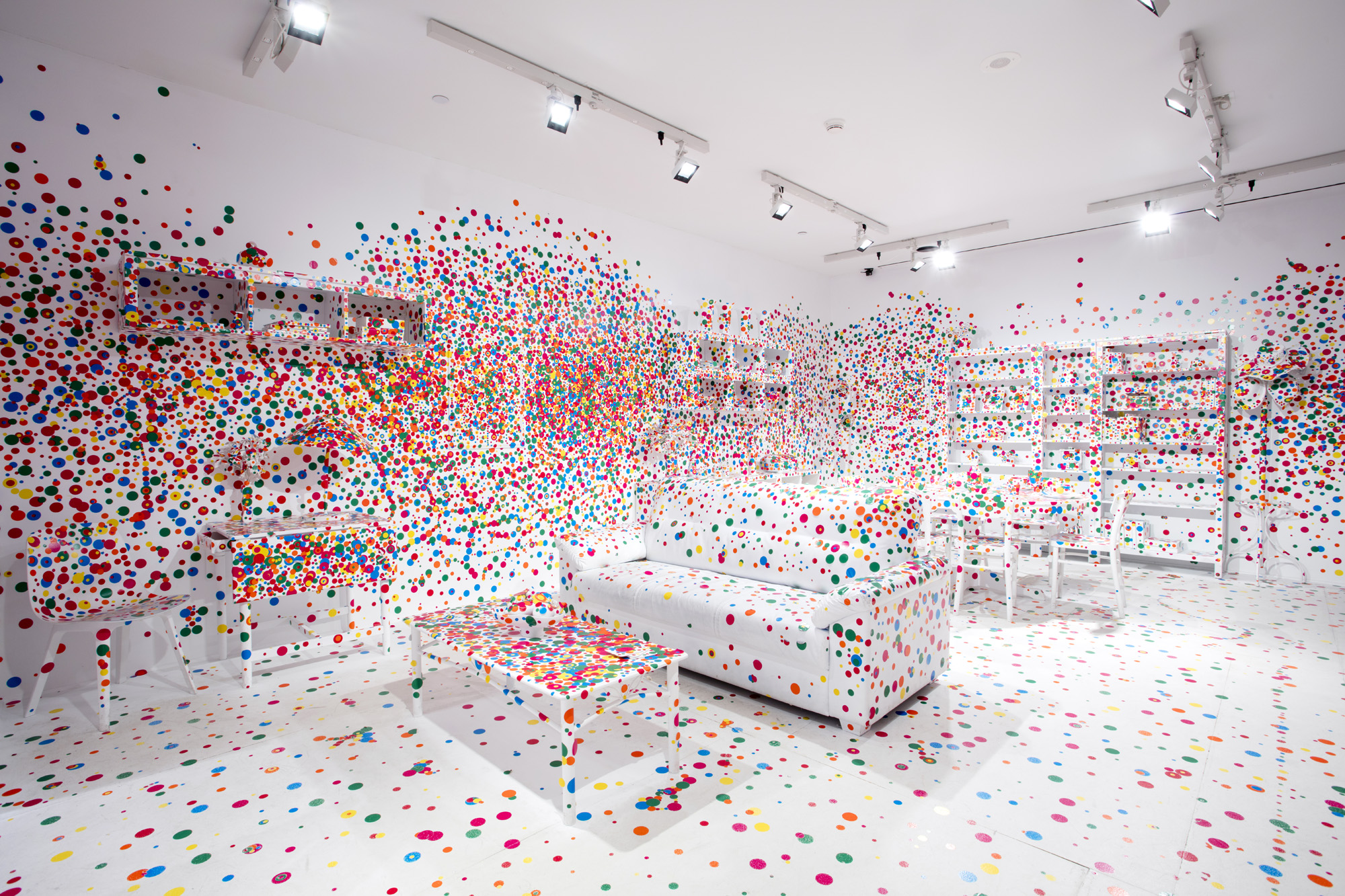 he AGO's The Obliteration Room covered with colourful dot stickers