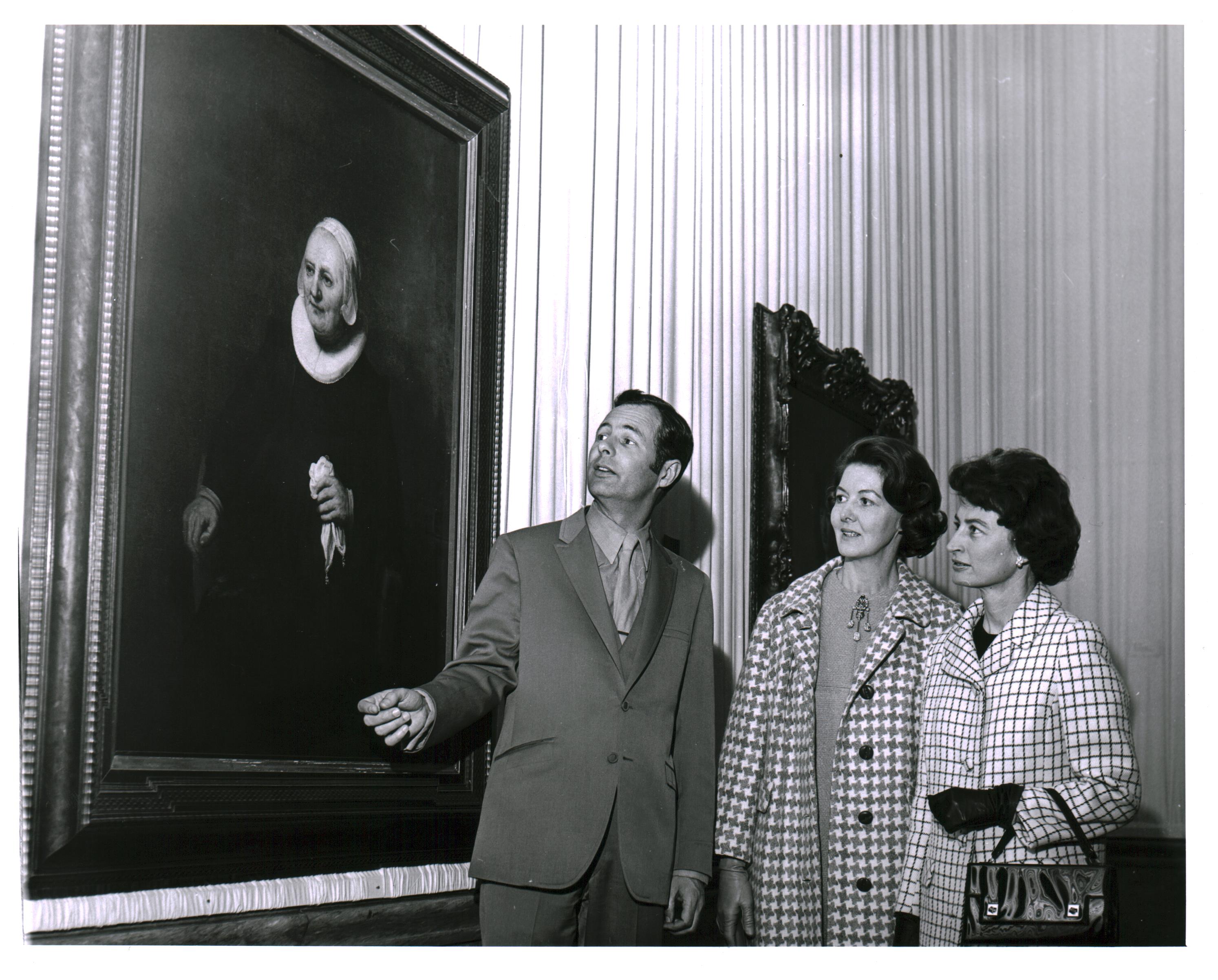Bill Withrow, unidentified woman and Mrs. W.R. Allen viewing Portrait of a Seated Woman with a Handkerchief