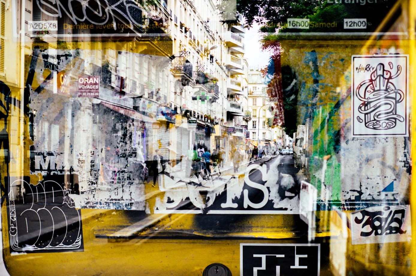 A double exposure photo of a city street and wall