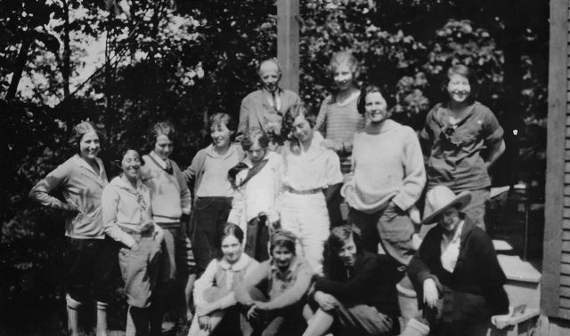 Black and white photo of people in the park