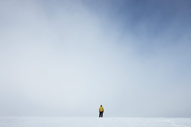 Man standing on snow in the distance