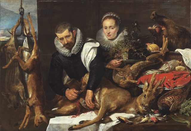 A man and women cleaning a Roebuk after hunting