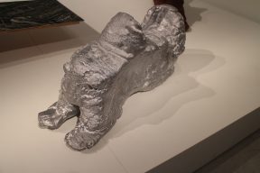 A silver sculpture of a sled.