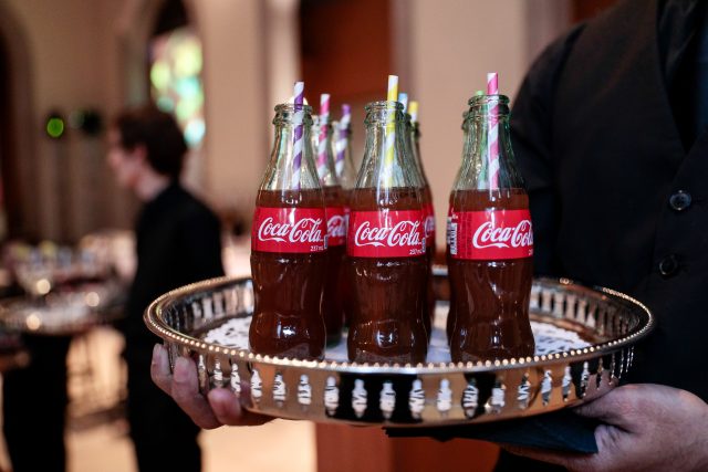 Coca Cola bottles on a tray