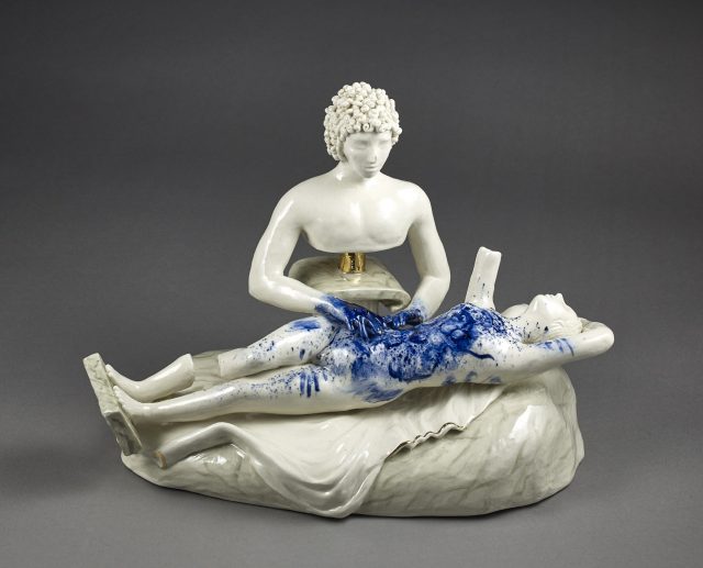 A porcelain sculpture of a man and woman.