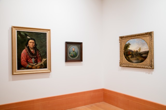 three paintings on wall