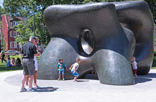 people infront of sculpture