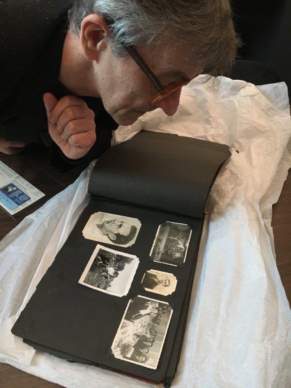 Dr. Ihor Holubizky viewing Gershon Iskowitz's photo archive.