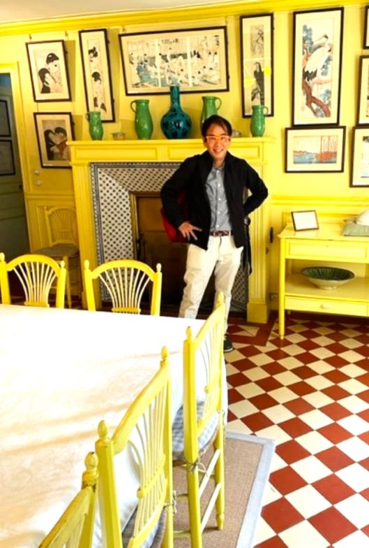 Image of a man inside of Claude Monet's kitchen