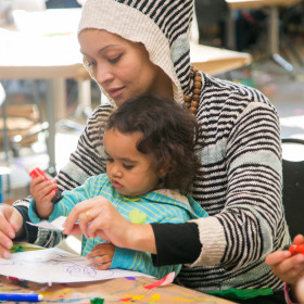 Woman and toddler making art