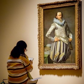 Woman sketching in the gallery