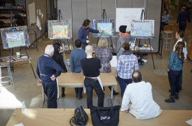 Adults listening to art instructor