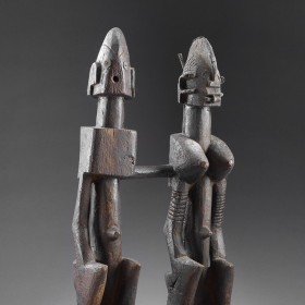 a scuplture depicting a seated couple