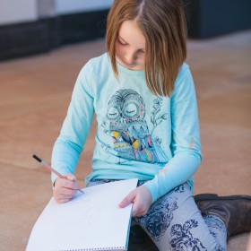 Child drawing in Walker Court