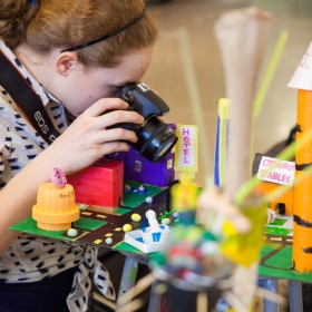Girl taking photo of her creation