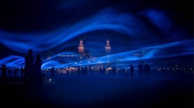 image of Waterlight installation with beams of light mimicking waves of water