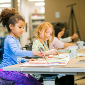 children painting at table