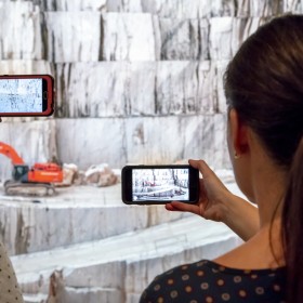 people using an AR app in the exhibition