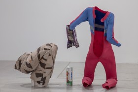 Installation view of Valérie Blass, The Mime, the Model and the Dupe, 2019, acrylic gesso, paint, plaster, copper, empty chip bag, jumpsuit, resin, epoxy and fiberglass