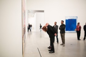 people looking at painting