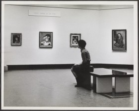 Person looking at paintings