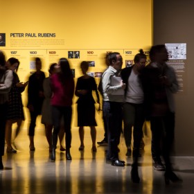 visitors walking into an exhibition space