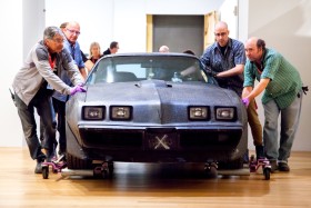AGO staff members carefully move the Trans AM