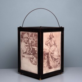 image of lantern with sepia images on the side panels