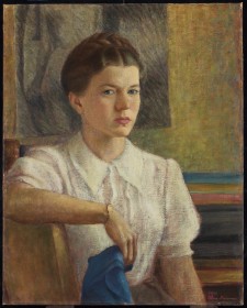 Alma Duncan sitting, looking at the viewer intently