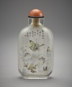 Small glass bottle with a copper red cap decorated with nine butterflies and flora and a Chinese poem
