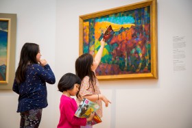 Children looking at art in the gallery