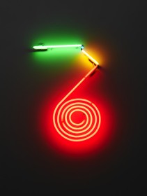two dimensional neon sculpture featuring green, yellow and red lines