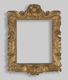 Photograph of decorative wooden English picture frame on white 