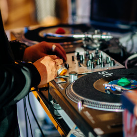 DJ - close up of hand and mixing board