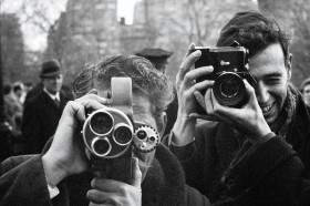 Two men with vintage cameras