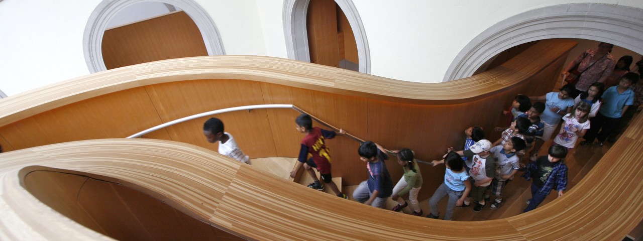 School tour on sculptural staircase