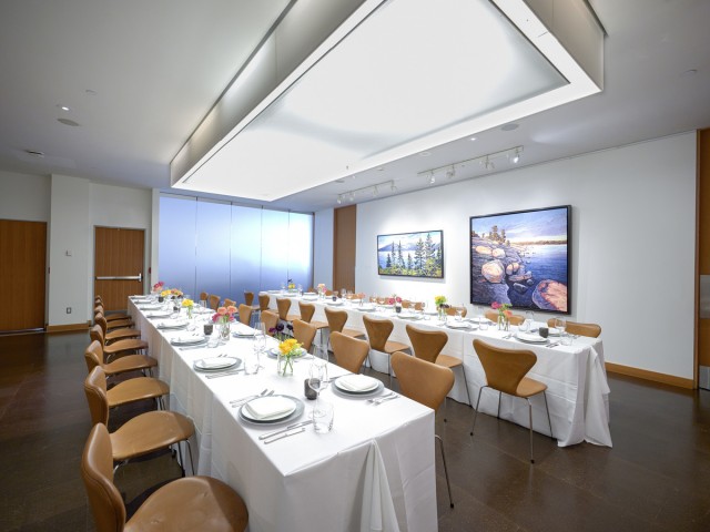 two long tables set for meal in Bistro Red Room