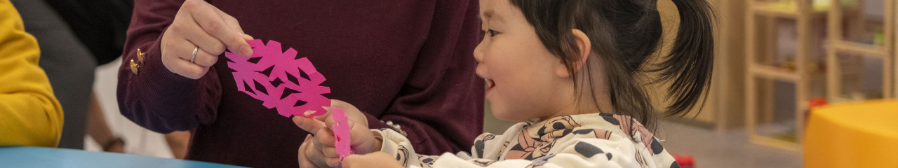 Woman and little girl making art together