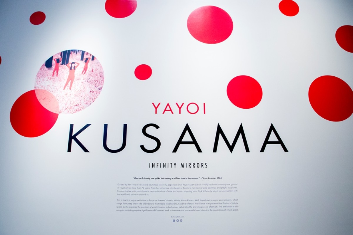 TOKYO, JAPAN - March 5, 2023: Signs and Yayoi Kusama motifs on a