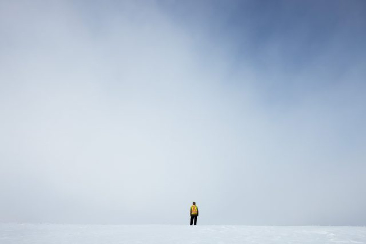 Man standing on snow in the distance